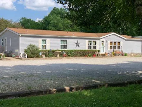 Front of Tina's Tiny Tots home daycare with gravel drive