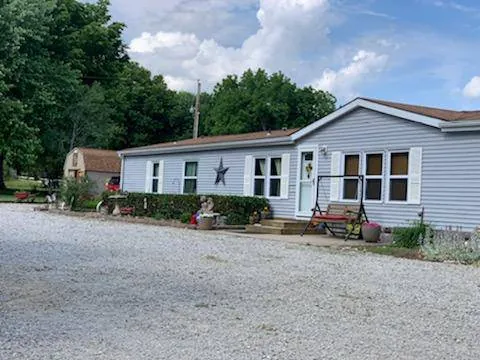 Tina's Tiny Tots home daycare building and yard