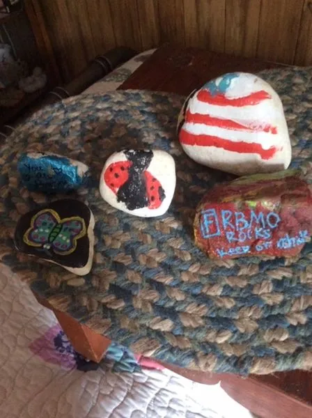 Colorful painted rocks with kind words