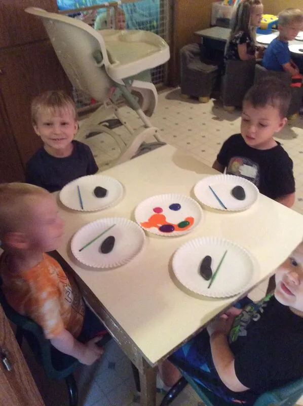 Kids painting rocks at Tina's Tiny Tots