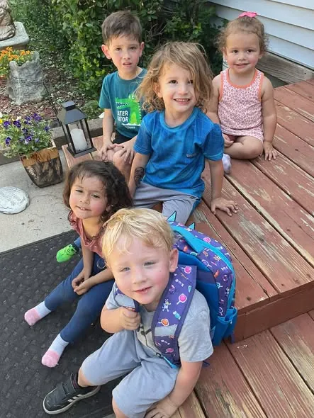 Children smiling together on the deck